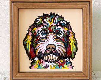 Puede incluir: Un retrato de un perro en papel recortado de colores en un marco de madera. El pelo del perro es una mezcla de rosa, verde, azul, amarillo y rojo.