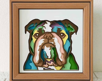 May include: A colorful, layered paper art piece of a bulldog's face in a wooden frame. The bulldog's face is made up of different colors, including blue, green, yellow, and pink.