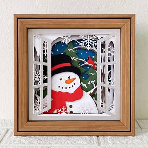 Caixa de sombra 3D com boneco de neve e cardeal em SVG, presente de Natal em papel recortado (download digital)