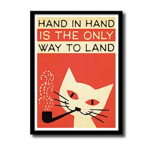 May include: A vintage-style poster featuring a white cat smoking a pipe. The cat has red eyes and a black nose. The poster has a red background and black text that reads "HAND IN HAND IS THE ONLY WAY TO LAND".