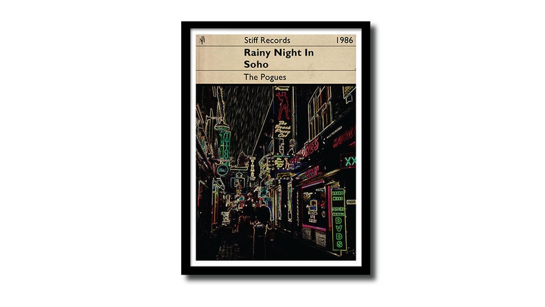 May include: A vintage album cover for "Rainy Night in Soho" by The Pogues. The cover features a black and white photo of a rainy street in Soho, London, with neon signs and streetlights. The album was released in 1986 by Stiff Records.