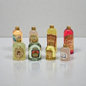 Miniature dollhouse multicolor kit eight bottles for perfumes and bath - 1/12 scale