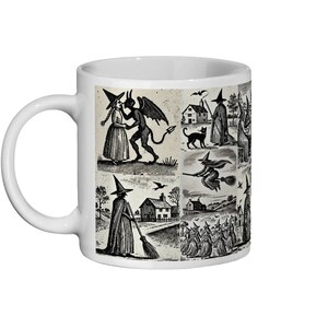 Dark, gothic-style mug with a woodcut illustration depicting witches and the Devil, perfect for Halloween or occult enthusiasts.