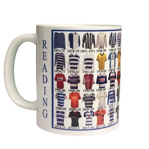 May include: White ceramic mug featuring a design of Reading Football Club kits from 1871 to 2018. The word "READING" is printed vertically on the side of the mug.