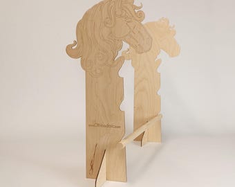 May include: A wooden horse-shaped coat rack. The rack is made of light-colored wood and features a detailed horse head design at the top. The rack has a horizontal bar for hanging items and a support base. The website address www.OWoodcnc.com is visible.