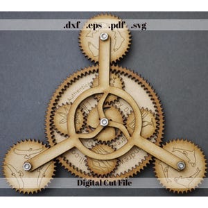 May include: A wooden gear mechanism with three outer gears connected to a central gear. The gears are light brown with etched designs and text. The text "Digital Cut File" is at the bottom, and file type extensions are at the top.