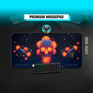 May include: A black rectangular mousepad featuring a skull and floral design, a black keyboard, and a black mouse. The mousepad has the text "PREMIUM MOUSEPAD" on top. The keyboard has multi-coloured keys.
