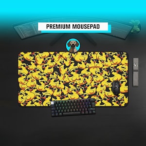 May include: A rectangular mousepad with a black border and a repeating pattern of yellow cartoon ducks wearing sunglasses. The text "PREMIUM MOUSEPAD" is displayed at the top. A black keyboard and mouse are on the pad.