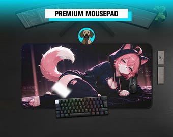 May include: A rectangular mousepad featuring an anime-style character with pink hair and cat ears, wearing a black hoodie with cat-themed details. The character has a large, fluffy pink tail and is lying down against a dark, abstract background.
