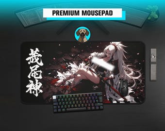 May include: A rectangular desk mat featuring an anime-style illustration of a long-haired character holding a katana. The design includes white Japanese kanji characters on the left side, a dark background with red accents, and a black computer mouse.
