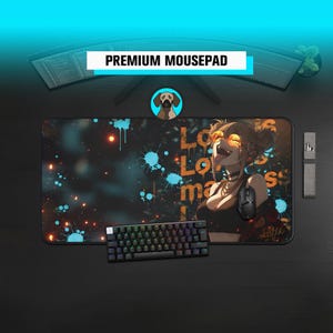 May include: A black and colorful mousepad with an anime-style illustration of a woman with orange hair and a black top. The mousepad has the text "Lo Lo ma s" and "PREMIUM MOUSEPAD". A black keyboard and mouse are also visible.
