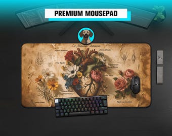 May include: A rectangular mousepad featuring a vintage-style anatomical heart illustration intertwined with colourful flowers and botanical labels. The background has a parchment texture with text including Cor Humanum Botanicum and various Latin names.