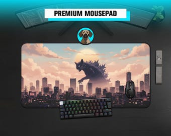 May include: A large rectangular mousepad with a cityscape design and a monster silhouette against a sunset sky. A black keyboard, a black mouse, and the text "PREMIUM MOUSEPAD" are also visible.