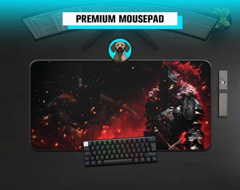 May include: A black and red gaming mousepad featuring a fantasy warrior design, a black keyboard, and a black mouse. The mousepad has the text "PREMIUM MOUSEPAD". A dog logo is also present.