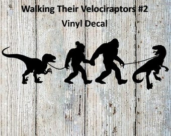 Mr. and Mrs. Bigfoot / Sasquatch Walking Their Velociraptors #2 Vinyl Decal