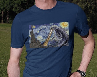 May include: A navy blue t-shirt with a graphic print of a Godzilla-like creature in a starry night sky, reminiscent of Vincent van Gogh's 'Starry Night'.