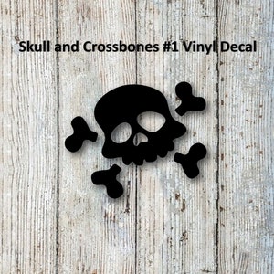 May include: Black skull and crossbones vinyl decal on a white wood background. Skull and Crossbones #1 Vinyl Decal.
