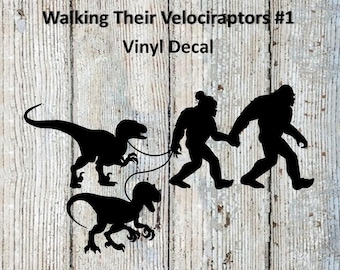 Mr. and Mrs. Bigfoot / Sasquatch Walking Their Velociraptors #1 Vinyl Decal