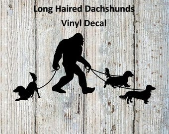 Bigfoot/Sasquatch Walking His Long Haired Dachshunds Vinyl Decal