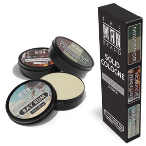 May include: Three 1-ounce tins of solid cologne in the scents Bay Rum, Woodsman, and Gentleman's Bourbon. The tins are black with white and gold labels. The packaging includes the text "The Man Brand" and "Solid Cologne Variety Pack 3 Pack".