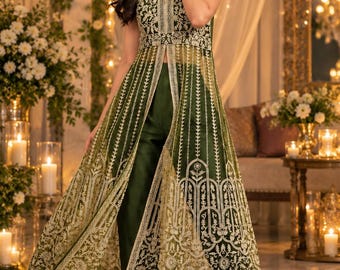May include: A sleeveless dark green ensemble featuring a long, sheer overlay tunic with intricate gold embroidery and a central slit, paired with matching dark green straight-leg trousers. The overlay displays detailed floral and geometric patterns.