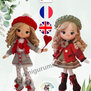 May include: Two handmade crochet dolls, one in a red beret and grey outfit, the other in a green hat and red jacket. The dolls have blonde hair and are holding a red heart. The image includes the text "amigurumi".