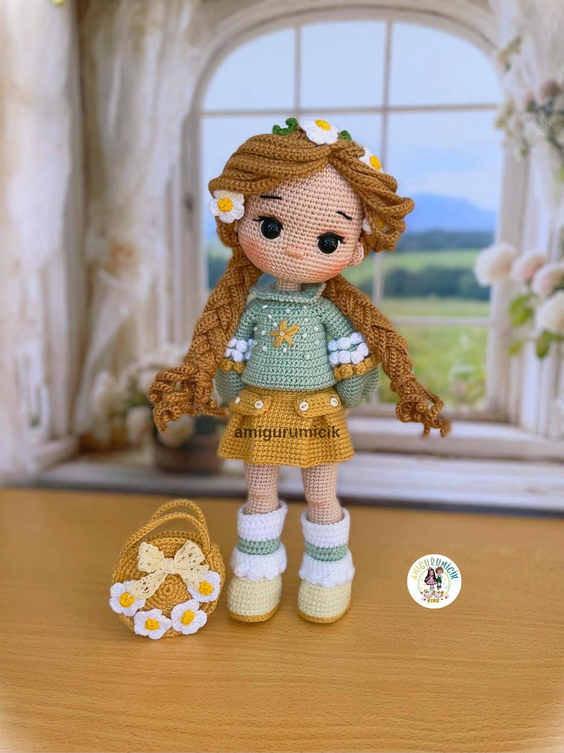 May include: A handmade crochet doll with long brown braids, adorned with daisy-like flowers. The doll wears a green sweater, yellow skirt, and white boots. A matching yellow basket with flower accents sits beside the doll. The doll is approximately 10 inches tall.