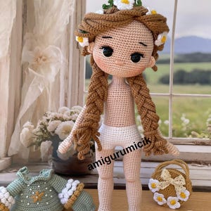 May include: A handmade crochet doll with brown braided hair adorned with white and yellow flower accents. The doll wears white shorts and has a matching crochet basket with flower details. A green and white crochet outfit is also present.