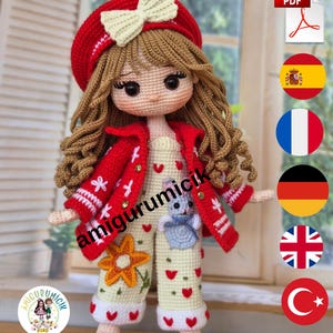May include: A crocheted doll with long wavy brown hair wearing a red beret with a cream bow, a red jacket with white embroidery, and cream-colored overalls featuring red heart patterns, a small blue animal appliqué, and a yellow flower motif.
