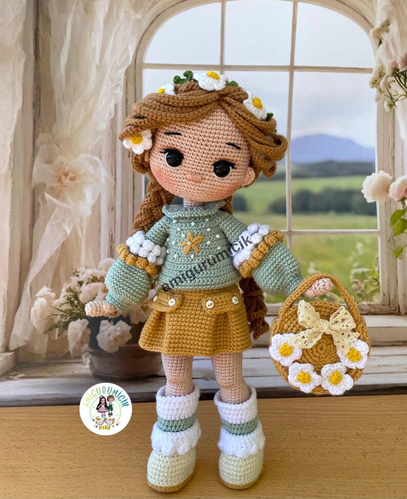 May include: A handmade crochet doll with brown hair adorned with a daisy crown. The doll wears a green sweater, mustard skirt, and white boots. A matching purse with daisy accents completes the ensemble. The doll is holding a small purse.