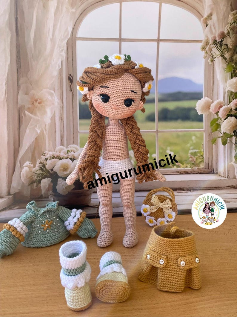 May include: A handmade crochet doll with long brown braids and a floral crown. The doll is surrounded by crochet clothing items, including a green sweater, a yellow skirt, and shoes. A small crochet purse is also present.