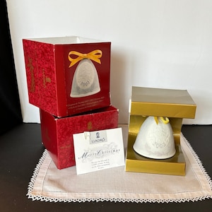 NIB Lladro 2003 Christmas Bell with Santa, XMas Tree, and festive etching; porcelain bisque; made in Spain