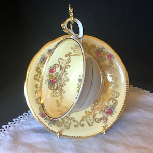 Aynsley bone china tea or coffee cup; yellow with pink rose/mixed floral & elegant gold trim work; made in England ca 1926-1934