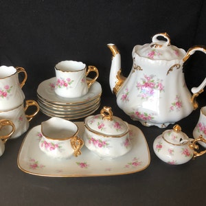 Fabulous commissioned tea or coffee set with pink roses and gold; 16 pieces (not counting lids or spoon), 1978