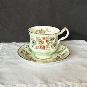 Paragon Antique Series &#39;Stuart&#39; pattern footed tea or coffee cup and saucer; mint green w/ tapestry floral; made in England; c 1960s-1970s