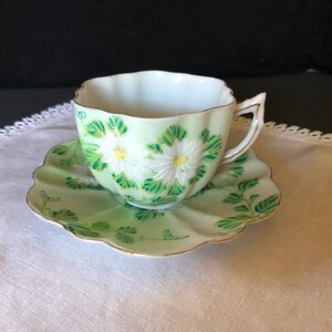 One of a kind vintage hand painted green & white tea/coffee cup and saucer; made in Japan ca 1920s-1940s.
