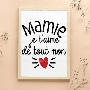 May include: A framed print with the text "Mamie je t'aime de tout mon" in black with a red heart in the center.