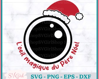 May include: A black and white illustration of a camera lens with a red Santa hat on top. The text "L'oeil magique du Père Noël" is written around the lens.