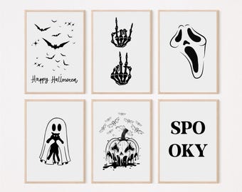May include: Six black and white Halloween themed printable art prints. The prints feature bats, skeletons, a ghost, a pumpkin, and the word "Spooky".