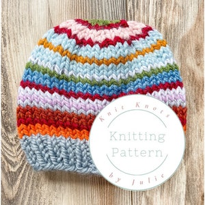 May include: A colorful striped knitted hat with a white circle label that says "Knit Knots Knitting Pattern by Julie".
