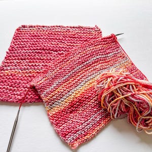 100% cotton dishcloth/washcloth in hues of pink on knitting needles