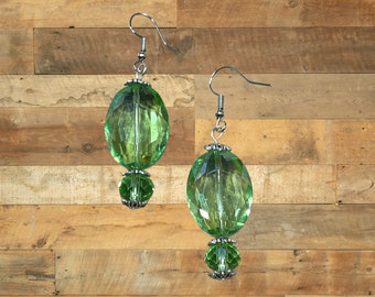 Glass bead earrings.  Drop earrings.  Green opaque faceted oval beads.  Green opaque faceted round beads.  Silver nickel free ear wires.