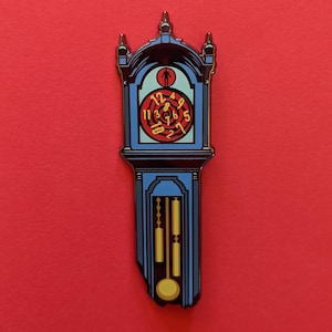 May include: A blue and gold grandfather clock with a red face and black Roman numerals. The clock has a pendulum and a small figure of a person at the top.