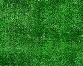 May include: A green textured background with a mottled, uneven surface.