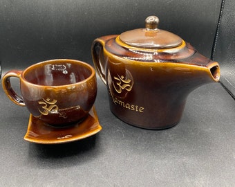 pottery tea set with tea cup and saucer that have Namaste etched into them heavy glaze 3 piece set
