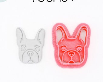 May include: A 3D printed cookie cutter in the shape of a French Bulldog's head. The cutter is made of PLA plant-based plastic and is non-toxic. The cutter is pink and white.