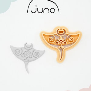 May include: A 3D printed cookie cutter in the shape of a manta ray. The cutter is made of PLA plant-based plastic and is non-toxic. The cutter is light grey and has a detailed design.