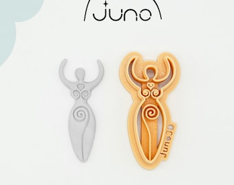 May include: A 3D printed cookie cutter in the shape of a woman with raised arms and intricate designs. The cutter is made of PLA plant-based plastic and is non-toxic. The cutter is light gray and is shown next to a similar cutter in a light orange color.
