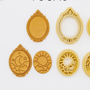 May include: Set of seven gold-colored 3D printed cookie cutters. The cutters are shaped like a sun, moon, clouds, and two different ornate frames. The text "3D PRINTED cutter" and "PLA plant-based plastic, non-toxic" is visible at the bottom of the image.