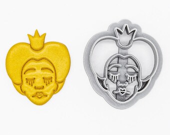 May include: A 3D printed cookie cutter in the shape of a queen's head with a crown. The cutter is made of PLA plant-based plastic and is non-toxic. The cutter is shown in both its yellow and silver colors.